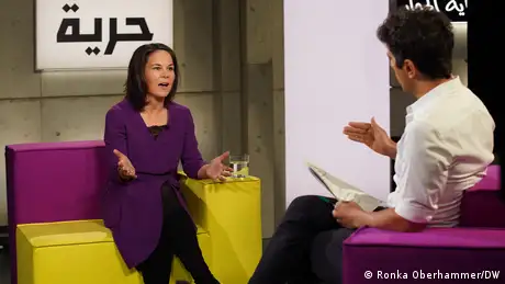 Germany's Foreign Minister Annalena Baerbock (left) speaks to DW's Jaafar Abdul Karim (right)