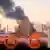 Клубы дыма после атаки дронов на НПЗ в Рязани, 13 марта 2024 года
